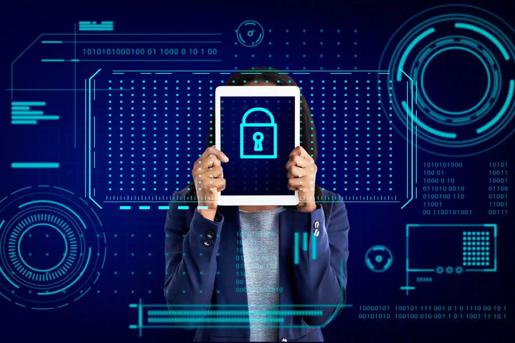 Security analyst holding a tablet displaying a padlock within a threat monitoring interface