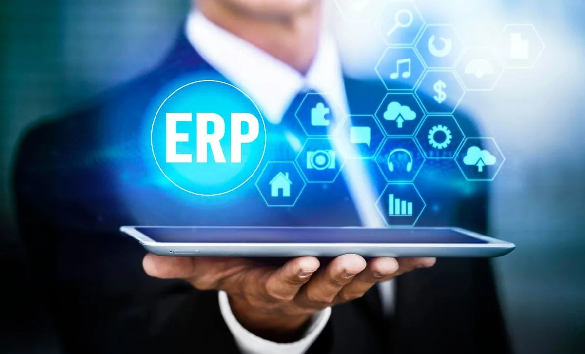 ERP dashboard linking finance, inventory, HR and sales modules on a tablet