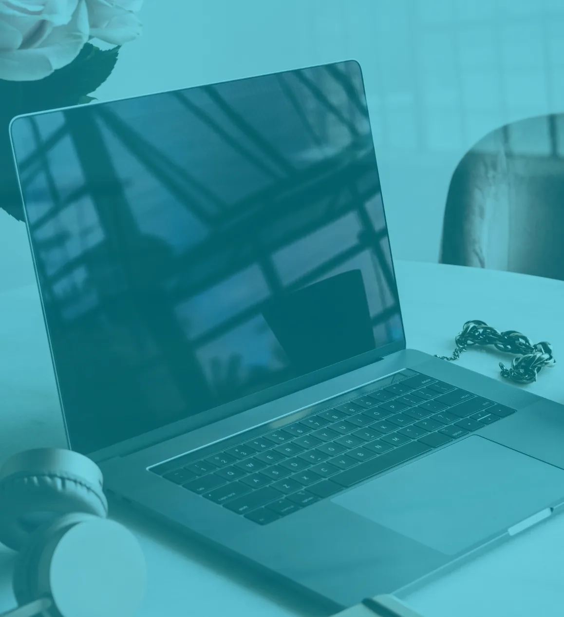 Business laptop set up on a meeting room table