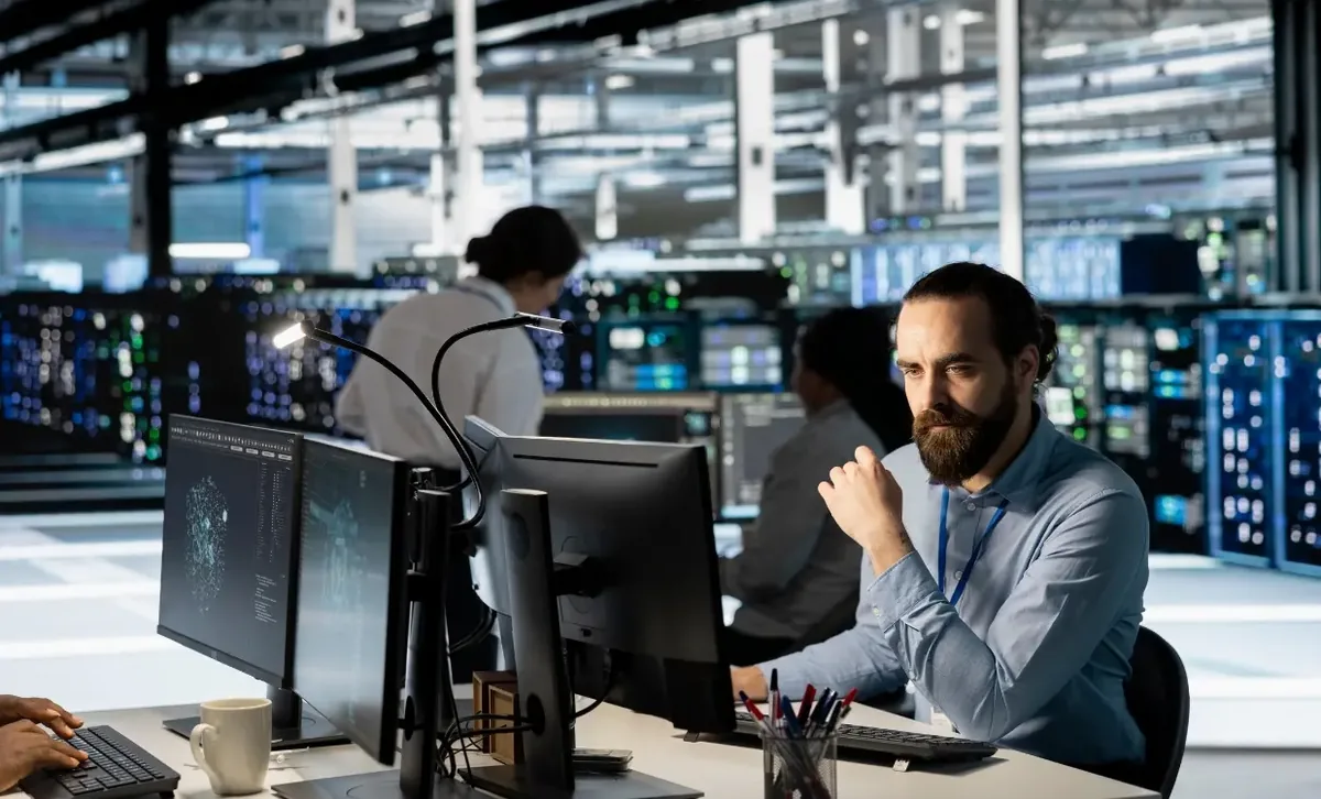Managed IT team monitoring client systems from a network operations desk